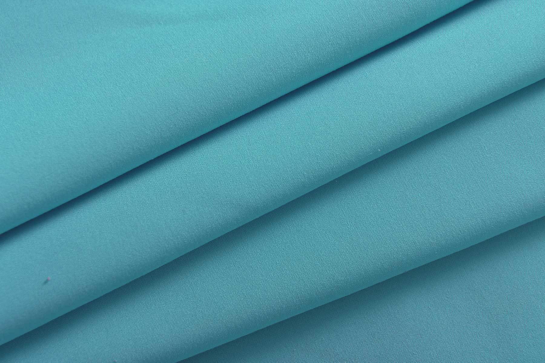 2er Set Vorhänge Schal Ösen »Berlin« Microsatin Lichtdurchlässig Uni Matt 20405N2 Vorhang 20400_detail_tuerkis_1_1 | Gardinenbox.de